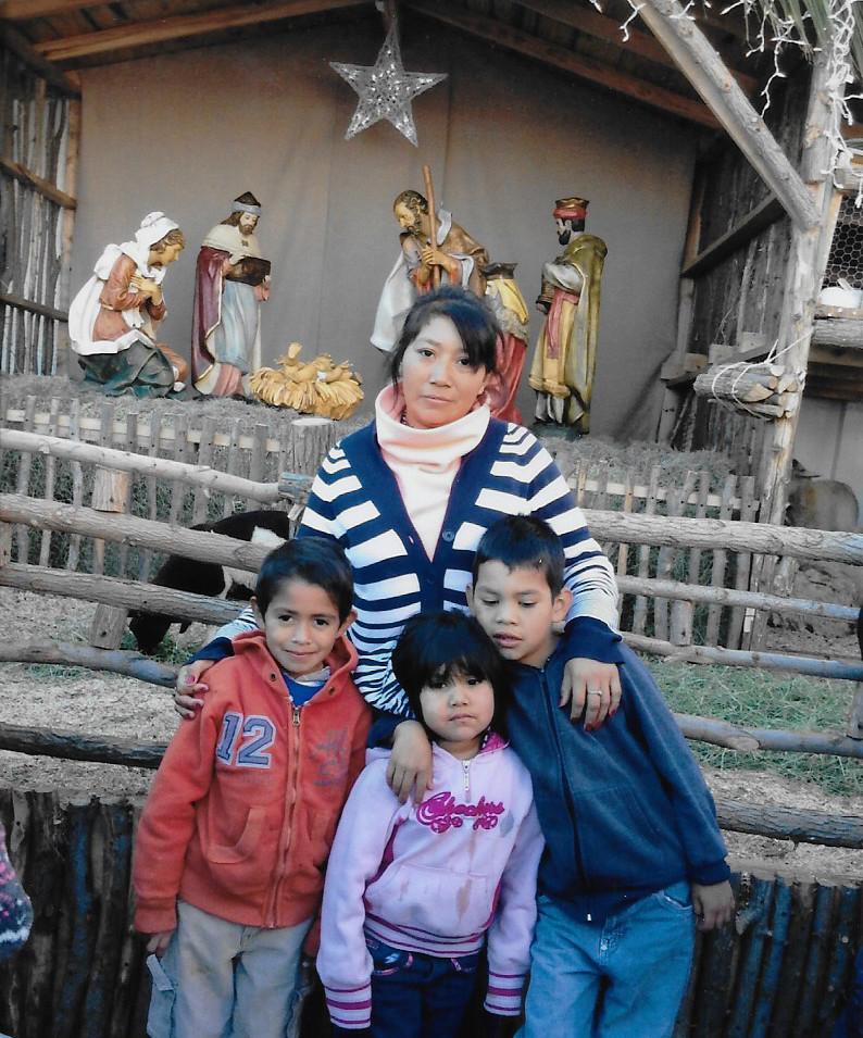 Family in front of manger scene